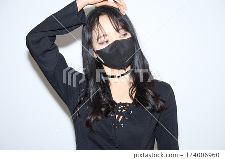 Fashion snap of a young woman wearing black casual outfit Fashion snap of a young woman wearing black casual outfit 124006960