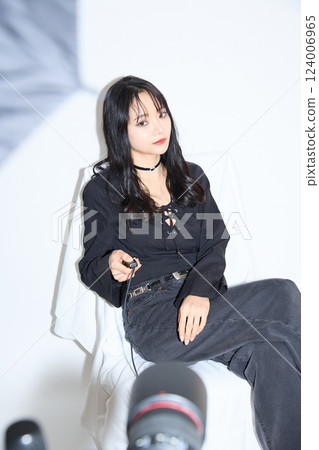 Fashion snap of a young woman wearing black casual outfit Fashion snap of a young woman wearing black casual outfit 124006965