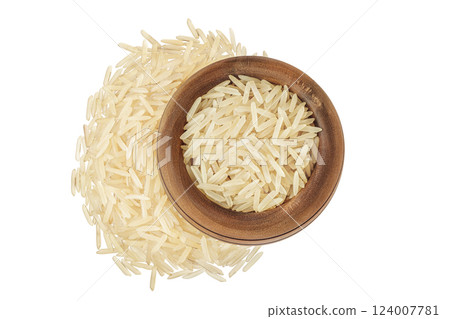 rice basmati in a wooden bowl isolated on white background. Top view. Flat lay 124007781