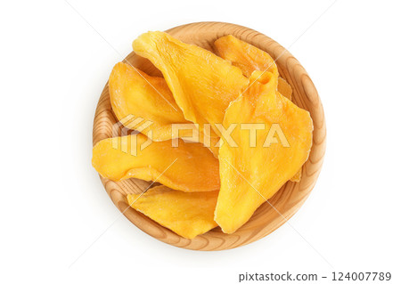 dried mango in wooden bowl isolated on white background. Top view. Flat lay 124007789