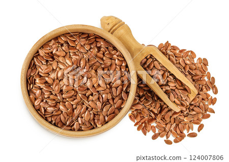 flaxseed in wooden bowl isolated on white background. Top view. Flat lay flaxseed in wooden bowl isolated on white background. Top view. Flat lay 124007806