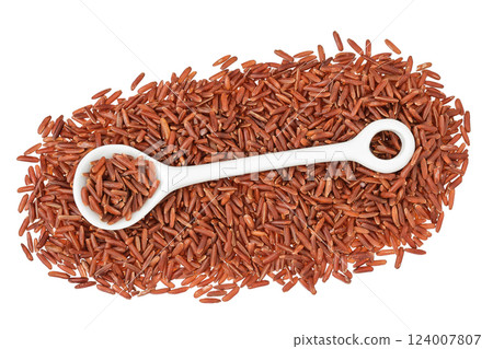 red rice in a ceramic spoon isolated on white background. Top view. Flat lay 124007807