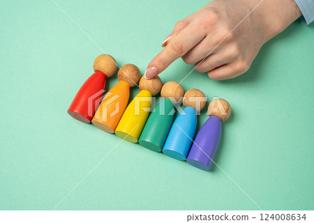 Hand chooses figures of people among LGBT representatives. Find yourself in the list of sexual orientations. Self-identification, exploring sexual orientations, and embracing personal identity. 124008634