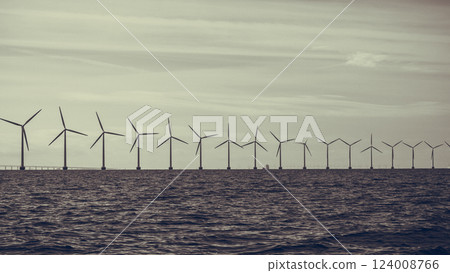 Wind turbines power generator farm along coast sea Wind turbines power generator farm along coast sea 124008766