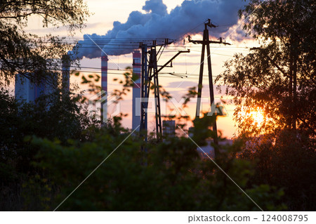 Smoke from chimney power plant station at sunset Smoke from chimney power plant station at sunset 124008795