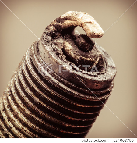 Auto service. Old spark plug as spare part of car. Auto service. Old spark plug as spare part of car. 124008796