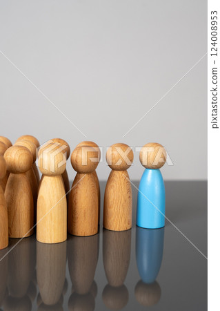 The blue man leads the crowd. Leadership, influence, and social mobilization. Guiding movements toward collective goals in social or organizational settings. 124008953