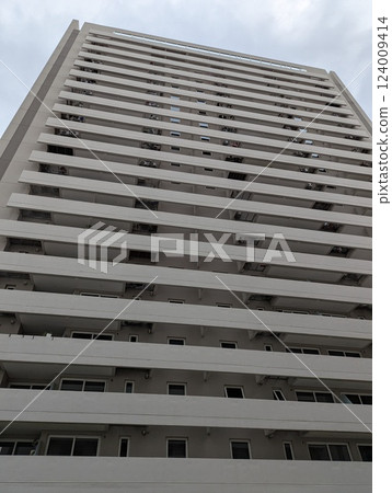 Cordoba, Argentina - 03.11.2025: Bottom view of the twenty-story Cardinales Cofico complex in cloudy weather. Vertical 124009414