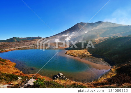 Autumn Daisetsuzan mountain range: Mount Asahi bathed in the morning sun, Sugatami pond 124009513