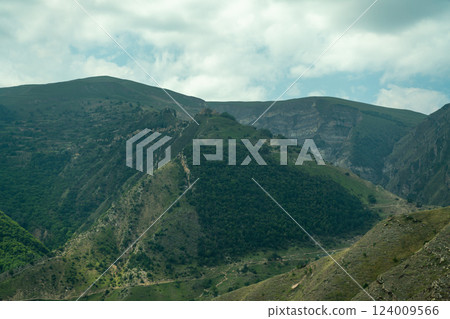 Caucasian mountain. Dagestan. Trees, rocks, mountains, view of the green mountains. Beautiful summer landscape. Caucasian mountain. Dagestan. Trees, rocks, mountains, view of the green mountains. Beautiful summer landscape. 124009566