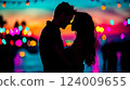 Couple shares a tender moment on the beach at sunset, creating a magical atmosphere filled with love and joy 124009655