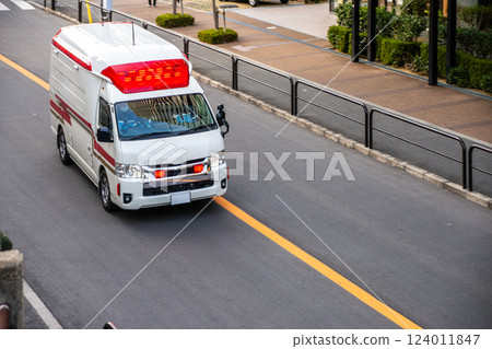 An ambulance crossing the center line An ambulance crossing the center line 124011847