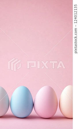 Pastel Easter eggs arranged on a pink background for festive decoration 124012135