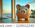 Scenery of a piggy bank placed on a desk by the window 124012240