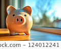 Scenery of a piggy bank placed on a desk by the window 124012241