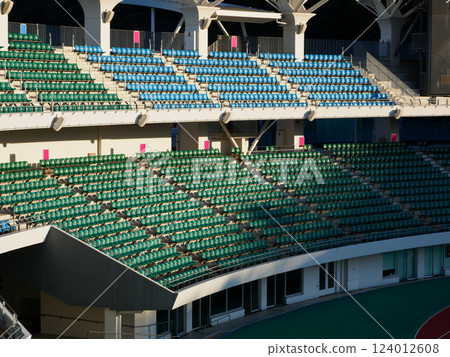 A large number of seats in a stadium A large number of seats in a stadium 124012608