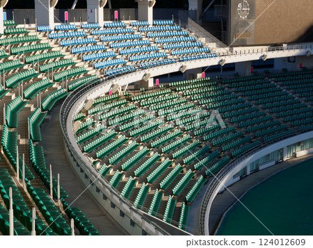 A large number of seats in a stadium A large number of seats in a stadium 124012609