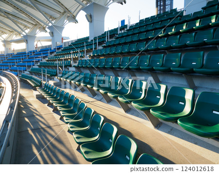 A large number of seats in a stadium A large number of seats in a stadium 124012618