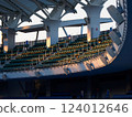 A large number of seats in a stadium 124012646