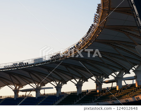 A large number of seats in a stadium A large number of seats in a stadium 124012648
