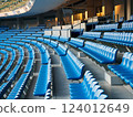 A large number of seats in a stadium 124012649