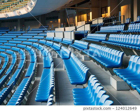 A large number of seats in a stadium 124012649