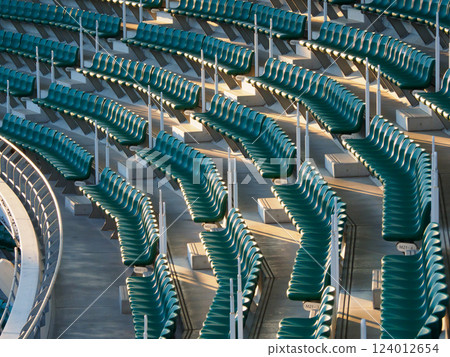 A large number of seats in a stadium 124012654
