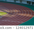 Well-maintained stadium grass and track 124012971