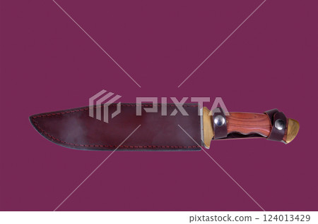 Bowie Knife in scabbard isolate over Burgundy Bowie Knife in scabbard isolate over Burgundy 124013429