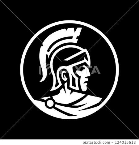 Greek warrior with a helmet on his head on a dark background. Greek warrior with a helmet on his head on a dark background. 124013618
