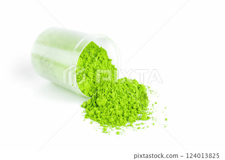 Vibrant Green Powder Spills From Container on White Background in Laboratory Setting 124013825