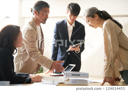 Business people having a meeting led by an older leader Business people having a meeting led by an older leader 124014455