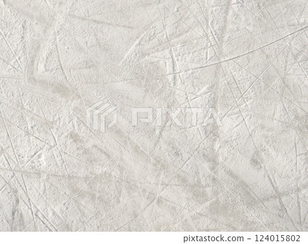 Ice background with marks from skating and hockey. Ice background with marks from skating and hockey. 124015802