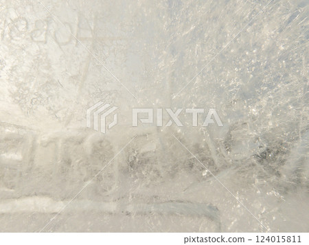 Ice texture background. Textured cold frosty surface of ice block with frozen air bubbles. Ice texture background. Textured cold frosty surface of ice block with frozen air bubbles. 124015811