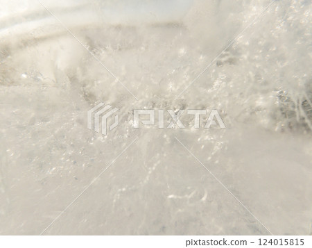 Ice texture background. Textured cold frosty surface of ice block with frozen air bubbles. Ice texture background. Textured cold frosty surface of ice block with frozen air bubbles. 124015815