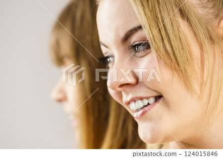 Portrait of happy blonde woman smiling with joy 124015846