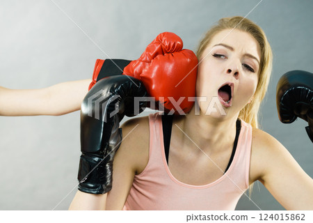 Woman getting punched in boxing fight Woman getting punched in boxing fight 124015862