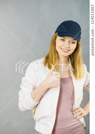 Happy woman wearing sporty outfit 124015867