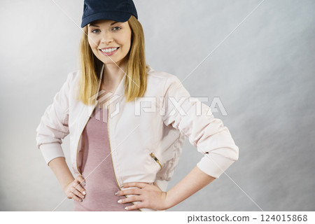 Happy woman wearing sporty outfit Happy woman wearing sporty outfit 124015868