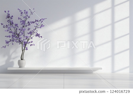 A white wall with a purple tree in a white vase 124016729