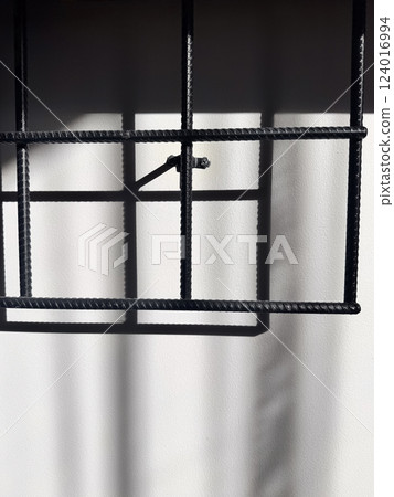 Metal Grid Casting Shadow on Wall, Abstract Composition, Light and Shadow Play. High quality photo 124016994