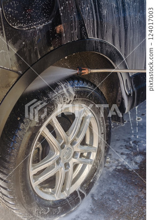 Car Wheel washing with Pressure Washer, Soap and Water, Vehicle Maintenance. High quality photo 124017003