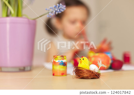 yellow chick in nest and blurred background with child drawing on easter yellow chick in nest and blurred background with child drawing on easter 124017842