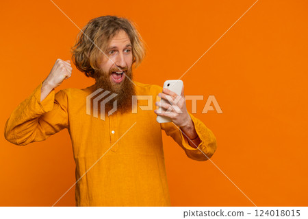 Happy excited winner man use smartphone celebrating success, winning play game, good lottery news Happy excited winner man use smartphone celebrating success, winning play game, good lottery news 124018015