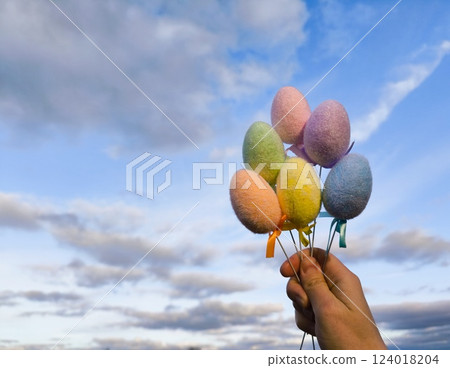 Multi colors Easter eggs on a bright sky background. Pastel color Easter eggs. Copy Space. 124018204