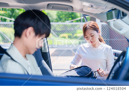 A young husband driving his wife home 124018504
