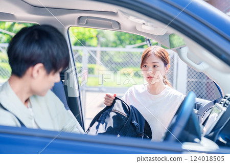 A young husband driving his wife home 124018505