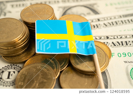 Stack of coins with Sweden flag and US dollar banknotes. 124018595