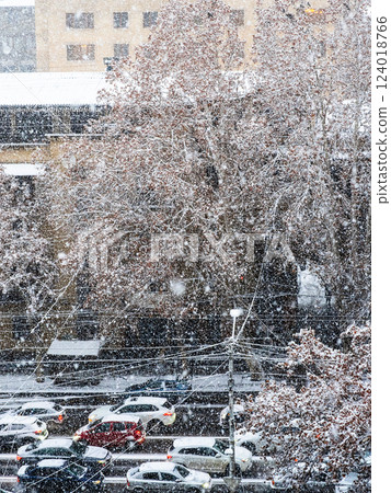above view of cars on street in snowfall in winter above view of cars on street in snowfall in winter 124018766
