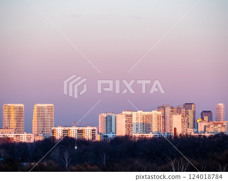 high-rise urban houses over city park at sunset high-rise urban houses over city park at sunset 124018784